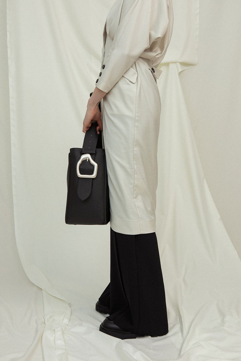 Cala Jade Masago black leather bag on model 2