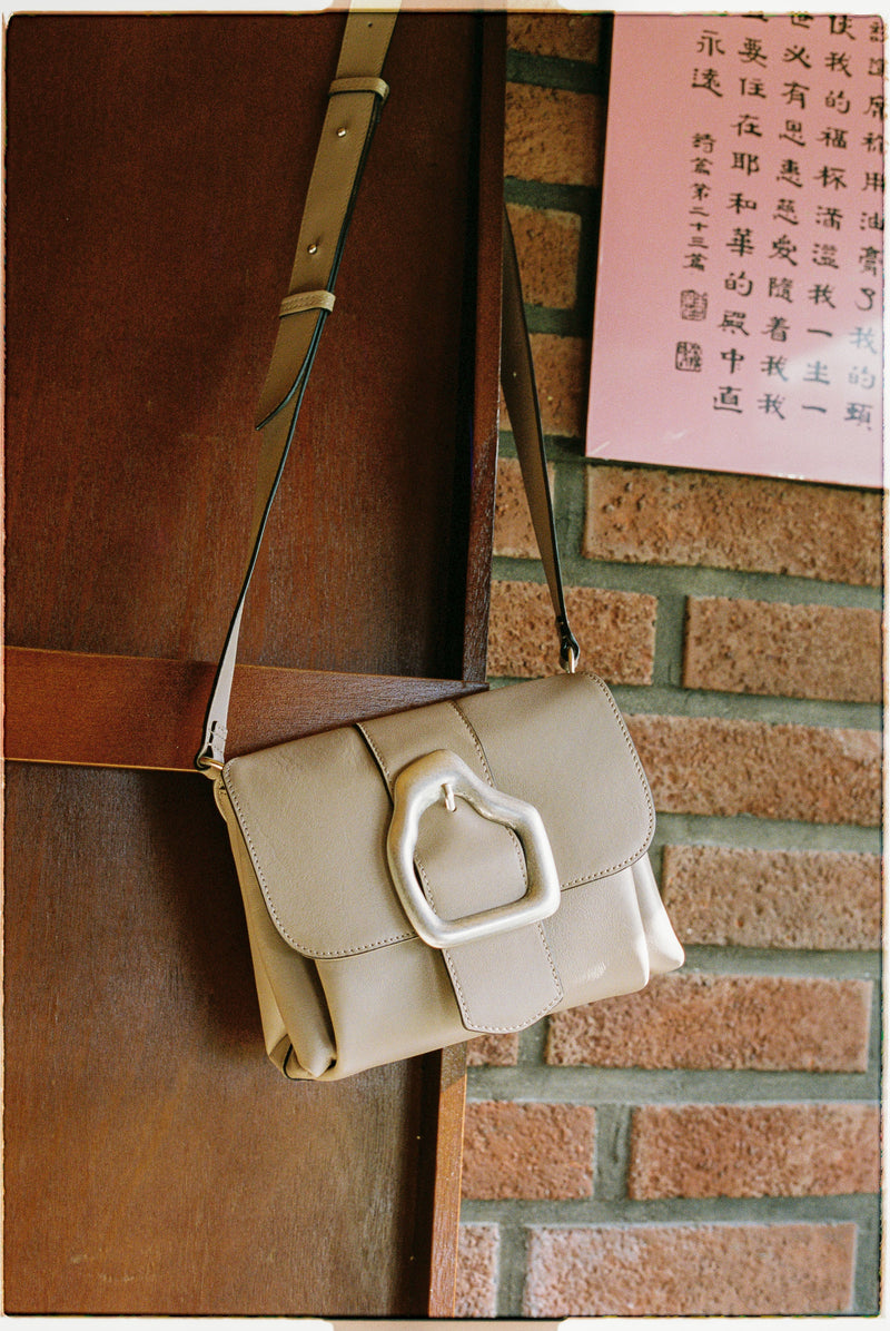 Cala jade shoulder bag in beige with a silver buckle